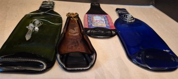 Two Melted Wine Bottles And Two Melted Beer Bottles Flatten By Heat