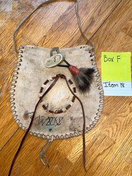 Leather Bag With Brown Leather Circle. Animal Fur Tassel On The Strap