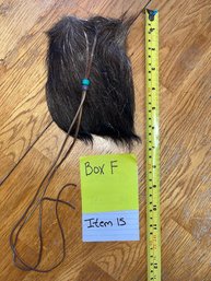 Small Bag With Brown Animal Fur On The Front And Tan Leather On The Back