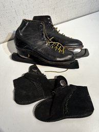 Pair Of Vintage Ice Skates And Moccasins