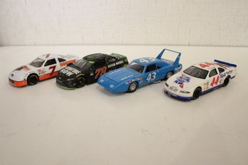 A Set Of 4 Die-cast Race Cars