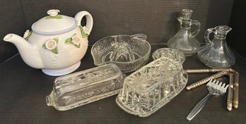 Sweet Grouping:  Ceramic Teapot With Applied Flowers, 2 Clear Glass Butter Dishes, Lemon Squeezer, Flower Frog