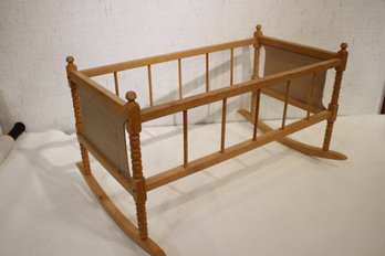 A Vintage Wooden Rocking Doll Crib