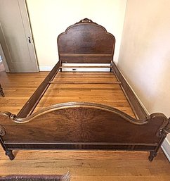 Antique Full Size Walnut Bed With Ornate Head Board And Foot Board With Railings And Wood Slats