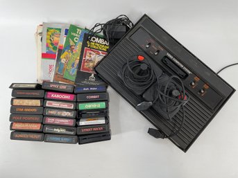 Vintage Atari Console, Controller And Cartridges Lot