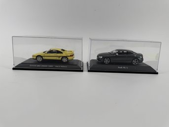 Two Die Cast Car Models In Case