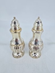 Vintage Salt And Pepper Shakers Appear To Be Crafted From Metal With A Tarnish-resistant Finish