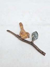 Collectible Decorative Sculpture Featuring A Bird Perched On A Branch, Likely Made Of Cast Metal