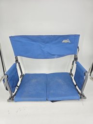RIO Adventure Folding Stadium Seat In Blue, Featuring A Steel Frame, Padded Seat And Back, And A Carry Strap
