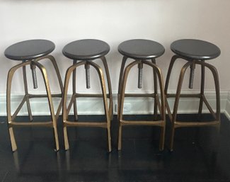 4 Adjustable Becket Bar Stools In Aged Brass