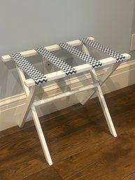 Navy And White Suitcase Stand By Gatehouse