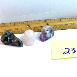 LOT 23, Rocks/crystals, 3 Pc., Larvakite Bird Skull, Amethyst And R. Quartz Human Skulls
