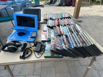 Two Portable DVD Players With Chargers Remote And Head Set Also A Nice Lot Of DVDs Great For The Kids