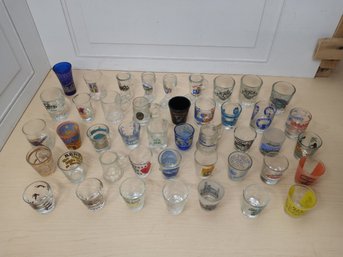 Collection Of 44 Souvenir And Novelty Shot Glasses From U.S. Cities And Beyond