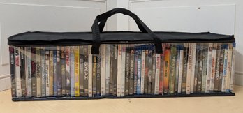 Over 50 Action, Comedy, And Sci-Fi DVDs In Zippered Soft Case Movie Collection