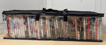 Over 50 DVDs In Zippered Case Featuring Comedy, Action, And Romance Films