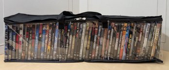 Over 50 Action And Military-Themed DVDs In Carrying Case Featuring Martial Arts