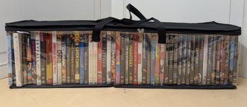 James Bond, Sci-Fi, And Action DVD Collection In Case With About 50 Titles