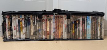 About 50 DVDs In Carrying Case Featuring X-Men, Underworld, Gladiator, Comedies