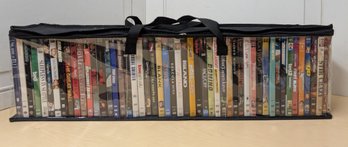 About 50 Mixed-Genre DVDs In Case Featuring Ted, Stargate, Love Actually, Rambo