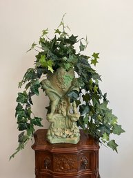 Faux Potted Plant In Cherub Inspired Resign Pot