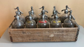 Collection Of Vintage Glass Seltzer Bottles In Blue Ribbon Crate