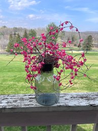 Artificial Cherry Blossom Or Plum Blossom Branch Arrangement In A Glass Vase