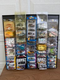 Large Collection Of Hot Wheels Die-cast Cars And Sets Mounted In A Specialized Display