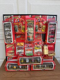 Mixed Lot Of 1:64 Scale Toy Cars Featuring Brands Such As Matchbox And Johnny Lightning