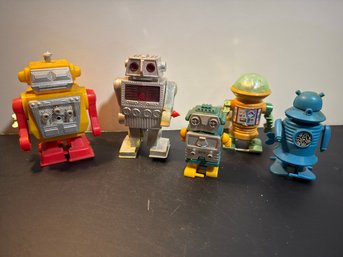 Collection Of Vintage-style Wind-up And Battery-operated Toy Robots, Including Models Like The Silver 'Astrona