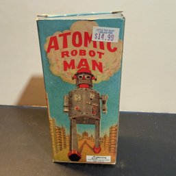 Vintage-style Tin Wind-up Toy Known As The 'Atomic Robot Man'.