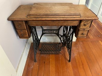 Antique Singer Treadle Sewing Machine In An Oak Cabinet