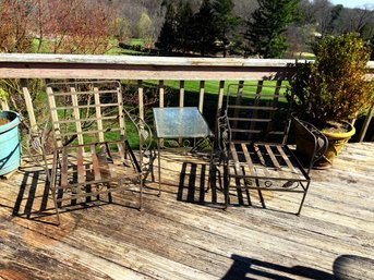 Vintage Wrought Iron Patio Set Featuring Ornate Grape Vine Motifs