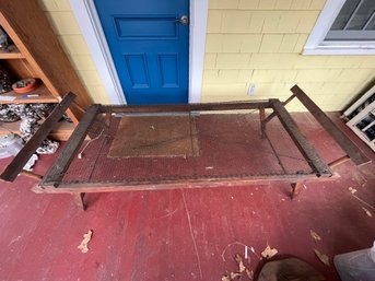 Vintage Folding Cot With A Wooden Frame And A Wire Mesh Sleeping Surface