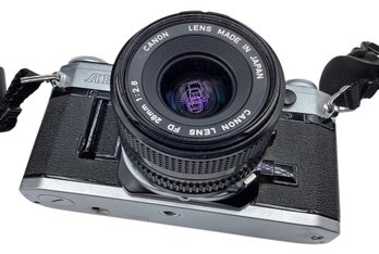 COLLECTIBLE VINTAGE: CANON AE-1 ANALOG FILM CAMERA WITH CANON 1:2.8 FD 28MM LENS