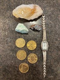 A Collection Of A Watch, Money, And Rocks