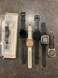 A Collection Of Watches/fitbits