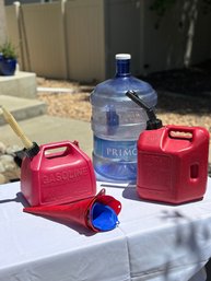 Gas Cans (2 Gallon, 1 1/2 Gallon) And Water Jug