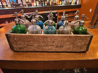 Crate Of Colorful Seltzer Bottles