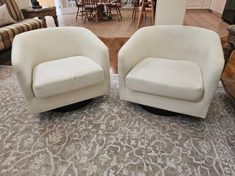 Two Designer Swivel Chairs