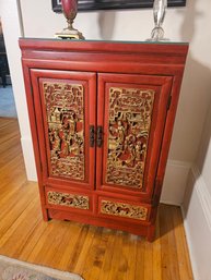 Chinese Red Lacquer Cabinet With Gold Carved Panels