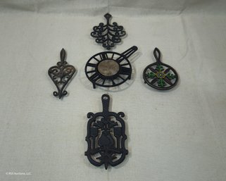 Assorted Vintage Cast Iron Trivets Group