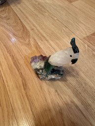 Carved Gemstone Parrot Figurine On A Amethyst Geode Base