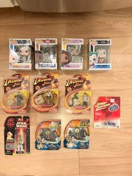 Collection Of Pops, Idiana Jones, And Star Wars Figurines