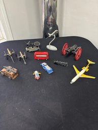 Collection Of Toy Vehicles And Artillery Pieces