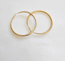BRAND NEW PAIR OF GOLD FILLED HOOP EARRINGS. MEASURES 2 1/2 X 2 1/2''