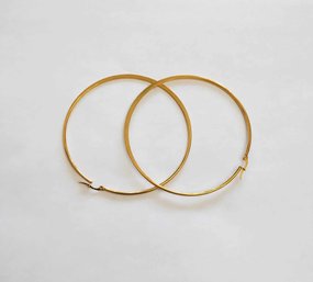 BRAND NEW PAIR OF GOLD FILLED HOOP EARRINGS. MEASURES 2 1/2 X 2 1/2''