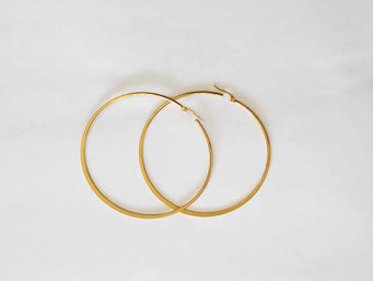 BRAND NEW PAIR OF GOLD FILLED HOOP EARRINGS. MEASURES 2 1/2 X 2 1/2''