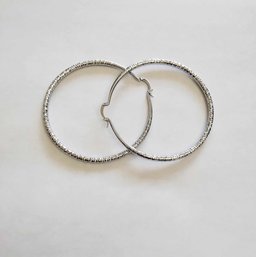 BRAND NEW PAIR OF SILVER FILLED HOOP EARRINGS. MEASURES 2 1/2 X 2 1/2''
