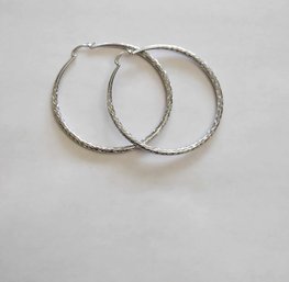 BRAND NEW PAIR OF SILVER FILLED HOOP EARRINGS. MEASURES 2 1/2 X 2 1/2''